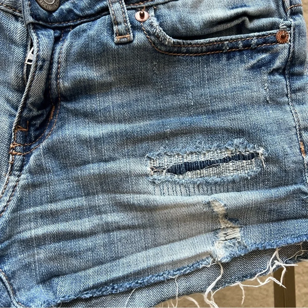 Distressed denim shorts.